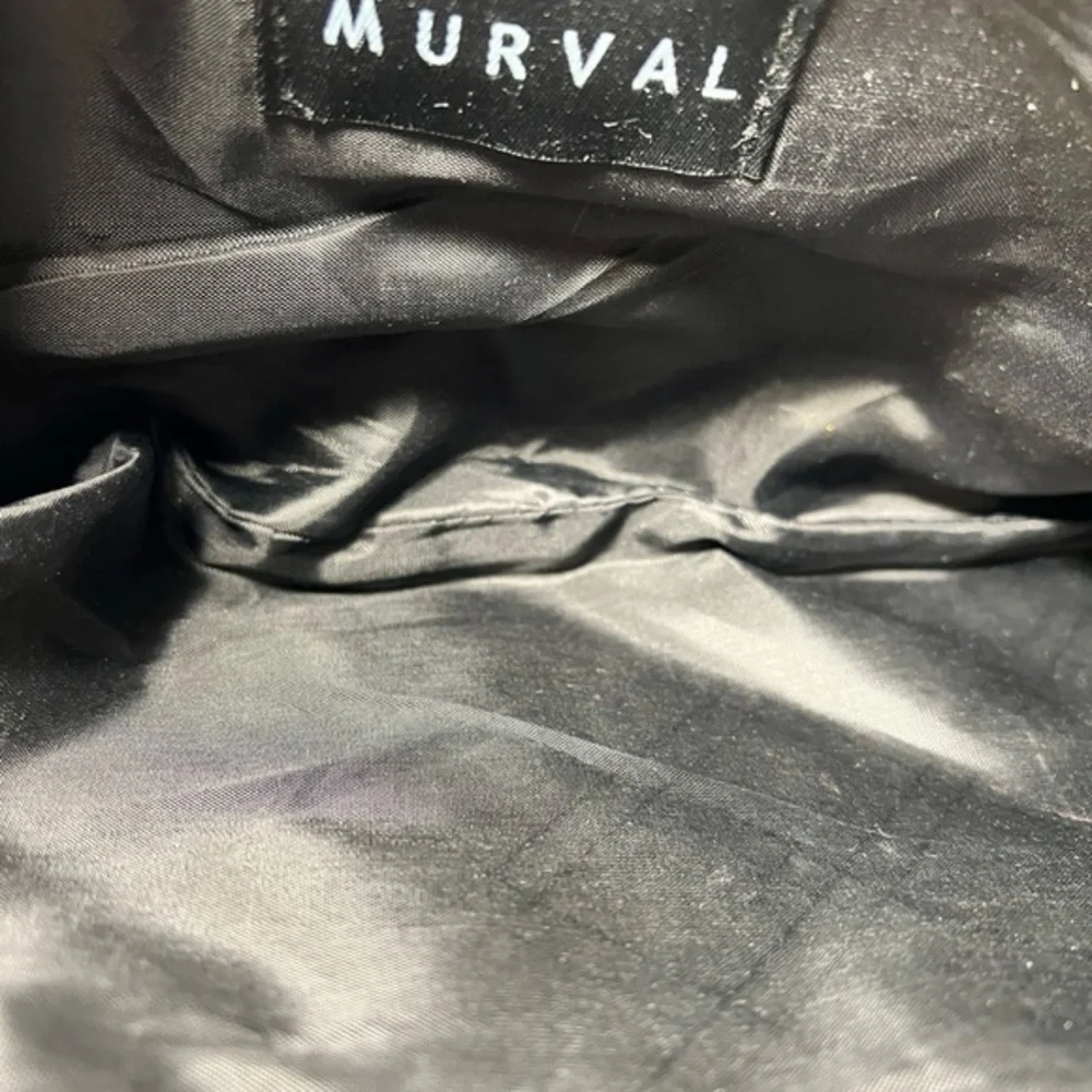Murval snap closure clutch